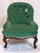 A Victorian spoon back chair with button back velour upholstery, raised on cabriole legs