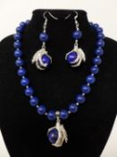 A lapis lazuli suite, to include lapis lazuli beaded bracelet, a beaded necklace and a pair of