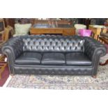 A 20th century black leather chesterfield sofa bed, H.70 W.203 D.90cm