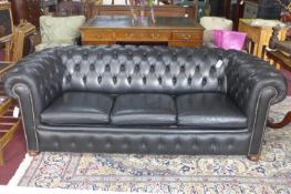 A 20th century black leather chesterfield sofa bed, H.70 W.203 D.90cm