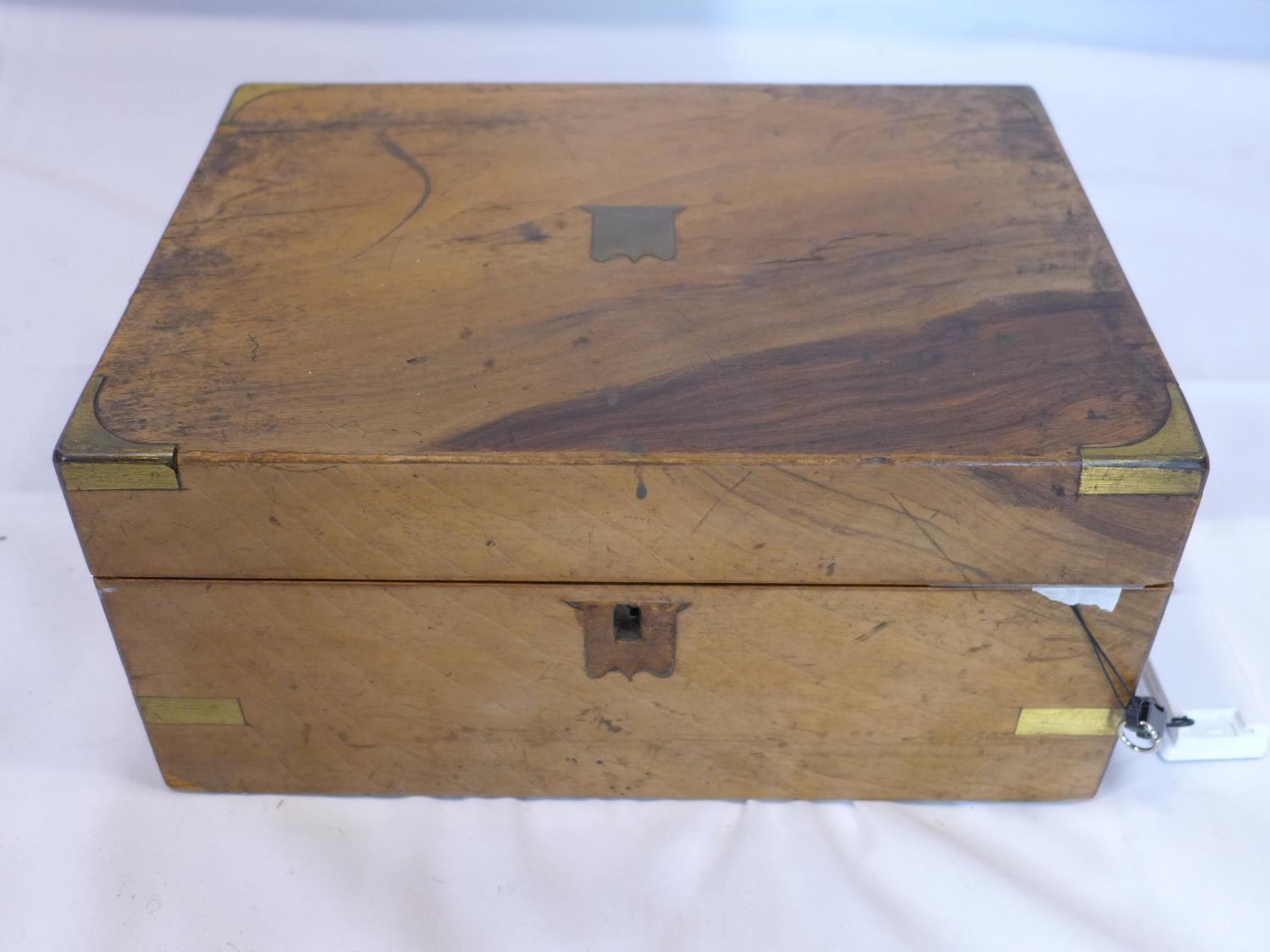 A Victorian walnut writing slope with fitted interior, H.14 W.30 D.23cm