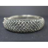 A silver and marcasite hinged bangle, Diameter 6.5cm