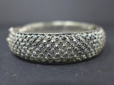 A silver and marcasite hinged bangle, Diameter 6.5cm