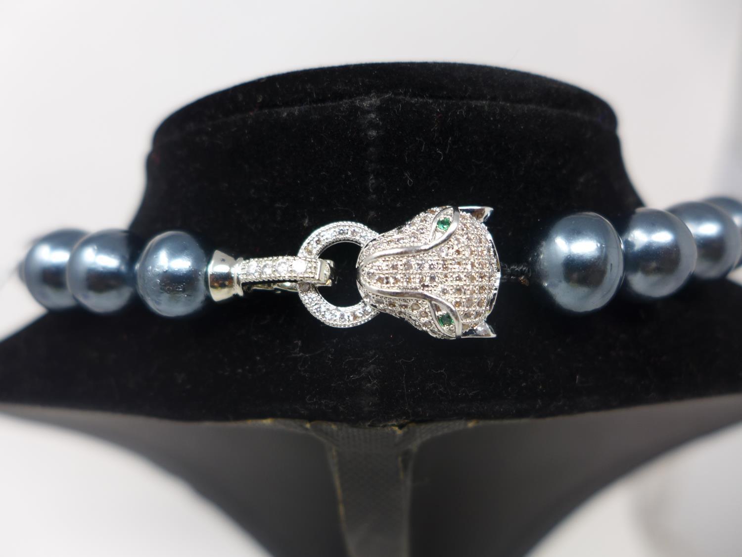 A Tahitian pearl beaded necklace with silver plated and cubic zirconia set panther clasp - Image 2 of 2