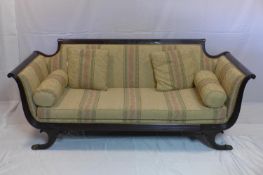 A Regency style mahogany sofa with wheat leaf carving, raised on scroll feet, H.80 W.196 D.79cm