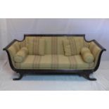 A Regency style mahogany sofa with wheat leaf carving, raised on scroll feet, H.80 W.196 D.79cm