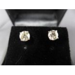 A pair of white gold and diamond stud earrings, 1.37ct in total