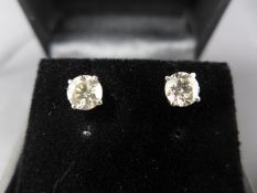 A pair of white gold and diamond stud earrings, 1.37ct in total