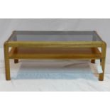 A 20th century teak coffee table with glass top, H.37 W.86 D.43cm