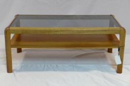 A 20th century teak coffee table with glass top, H.37 W.86 D.43cm