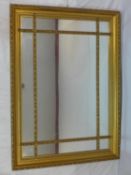 A Regency style gilt wood sectional mirror, 136 x 100cm