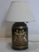 A 19th tole ware tea caddy hand painted with armorial crest, converted to a lamp, H.36cm