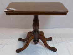 A 19th century mahogany tilt top table, raised on reeded baluster support and four splayed legs, H.