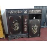 A 19th century Chinese hardwood cabinet, with mother of pearl inlay, raised on carved and pierced