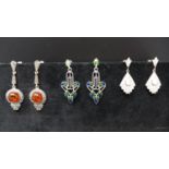 Three pairs of silver earrings, to include one pair set with faux amber; one pair of fan design