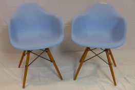 A pair of Eames style chairs