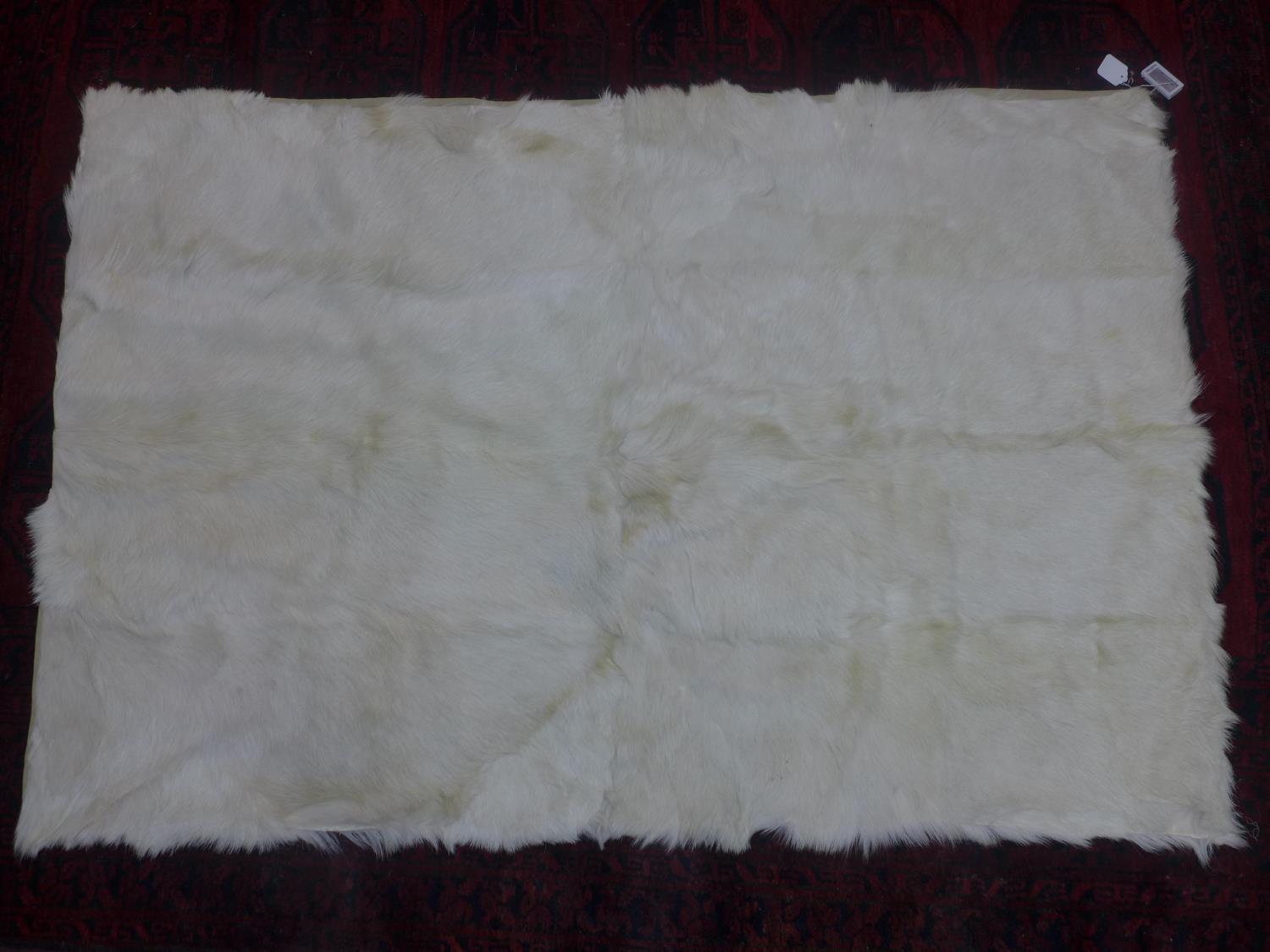 An animal hide rug, 180 x 120cm