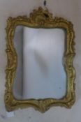 A Rococo style gilt plaster mirror, plate is loose, 58 x 40cm