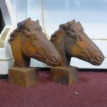 A pair of cast iron horse heads, H.29.5cm (2)