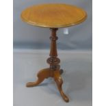 A mahogany tilt-top table, with circular top above turned support and three outswept feet, H.71cm