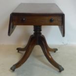 A 19th century mahogany Pembroke table, with single drawer and faux drawer, raised on turned support