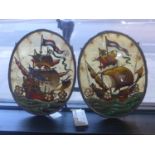 Two late 19th / early 20th century Dutch oval paintings on glass of ships firing their cannons, in