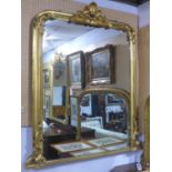 A large 20th century giltwood overmantle mirror, with C-scroll and shell finial, 152 x 120cm