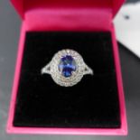 A 18ct white gold, diamond and sapphire ring, boxed