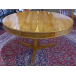 A yew wood circular drum table, with four drawers, on tri-form base, H.71cm Diameter 142cm