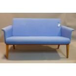 A blue 2 seater Lazy Sofa by Swedese