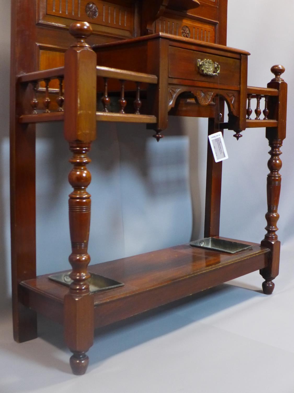 A Victorian Aesthetic mahogany hallstand, having shield mirror with bevelled plate, with single - Image 2 of 6