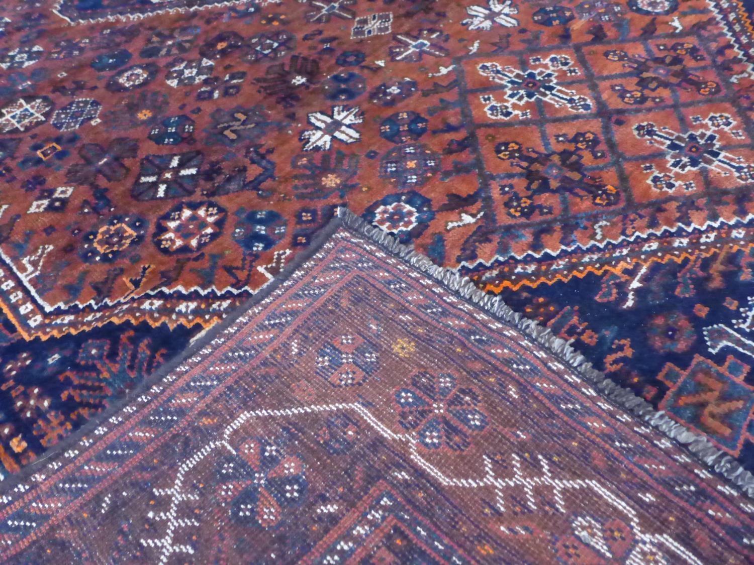 A South-West Persian Qashqai carpet, central diamond medallion with repeating petal and animal - Image 5 of 5