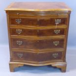 A walnut serpentine chest of 4 graduated drawers with brush slide, having cross-banded top, on