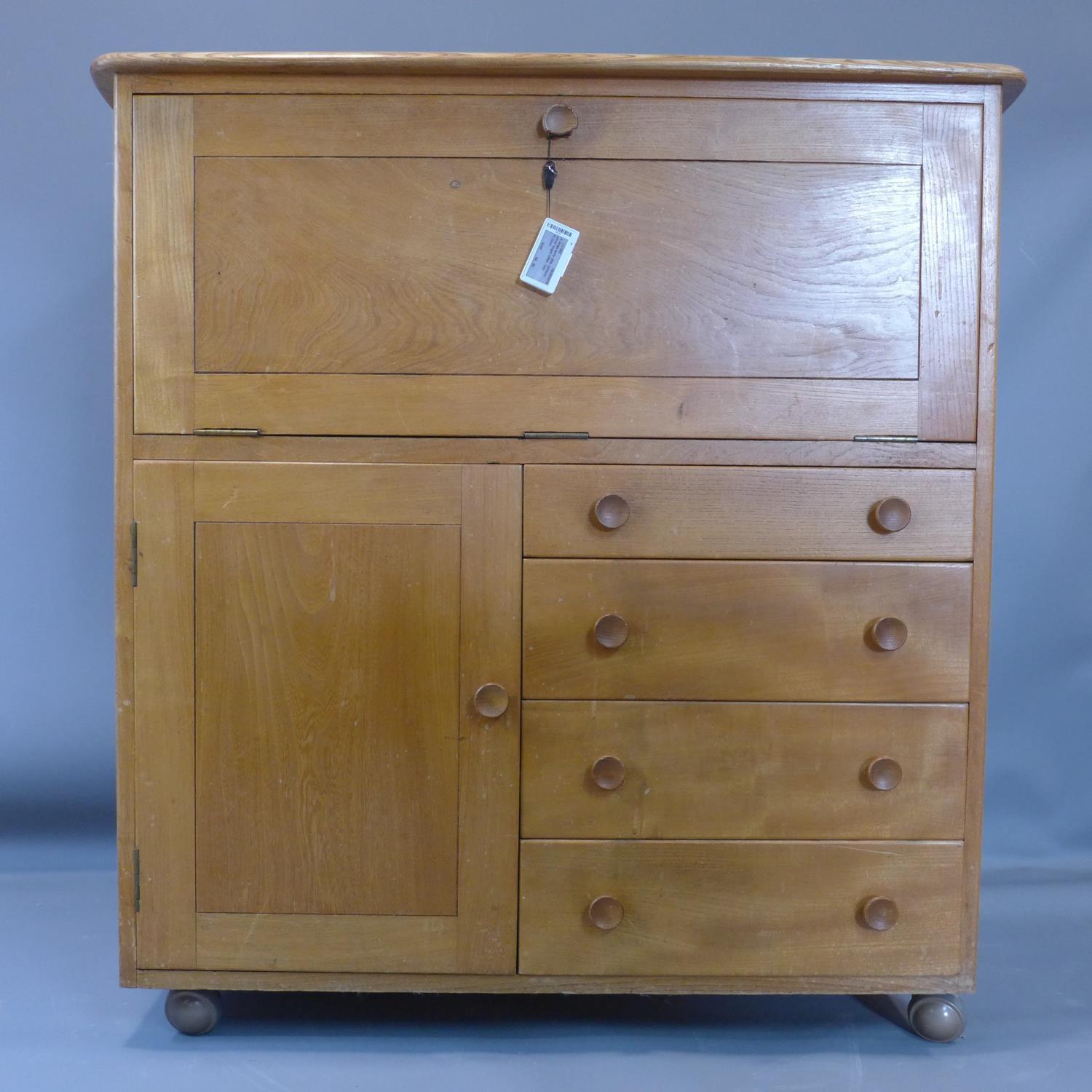 A 20th century Ercol bureau, bearing label, H.102 W.98 D.46cm