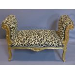 A giltwood window stool with leopard print upholstery, on cabriole legs, H.69 W.107 D.46cm