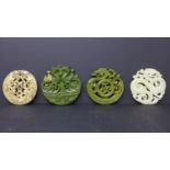 Four Chinese hardstone pendants, carved with dragons, phoenixes and scrolling foliage, largest 8cm