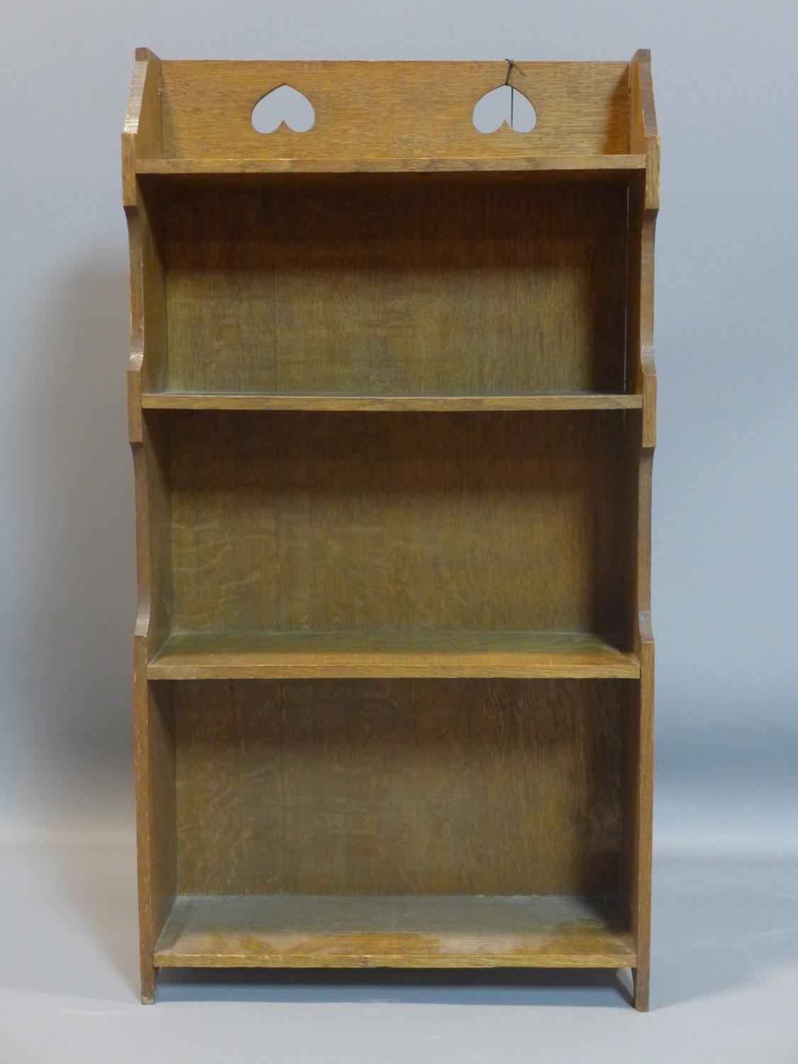 An Arts and Crafts oak open bookcase, H.80 W.43 D.15cm