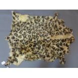 A wild cat fur rug possibly an Ocelot, 109 x 85cm