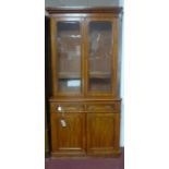 A Victorian mahogany bookcase, 2 glazed doors above 2 cupboard doors, raised on stepped base, H.