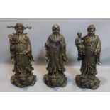 Three Chinese cast bronze figures of the Sanxing (Three Stars), to include Prosperity (Fu),