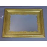 A ornate giltwood wall mirror, with floral border