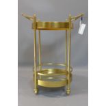 A contemporary gilt two tier drinks trolley, with circular mirrored tops, with handles to top,