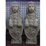 Two reconstituted stone lions with armorial shields, H.77cm (2)