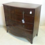 A Georgian mahogany bow front chest of drawers, raised on splayed feet, H.105 W.108 D.55cm