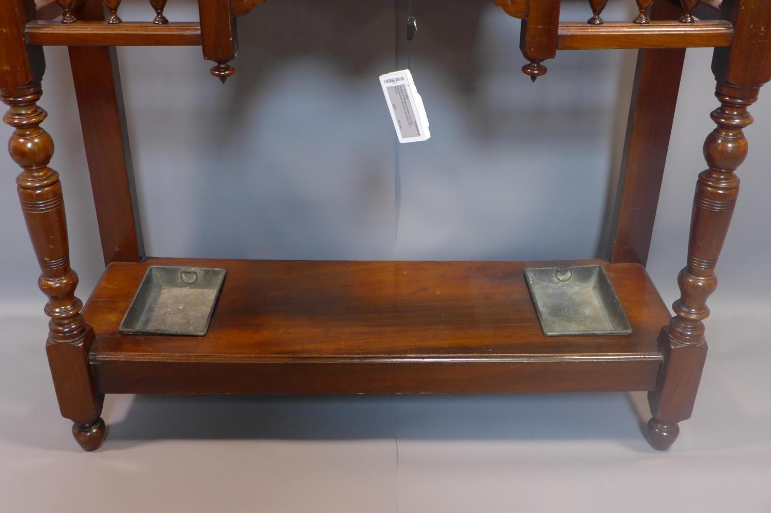 A Victorian Aesthetic mahogany hallstand, having shield mirror with bevelled plate, with single - Image 5 of 6