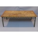 An Indian teak low table, on cast metal supports, H.46 W.135 D.74cm