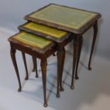 An early 20th century mahogany nest of 3 tables, on cabirole legs