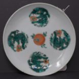 A 19th century Chinese famille verte dragon dish, small chip to rim, D.14cm