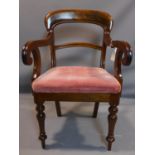 A 19th century mahogany desk chair, with scroll arms and drop in seat, on turned legs