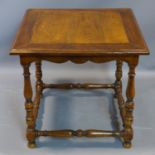 An antique style square low table on stretchered turned supports H.56 W.60cm